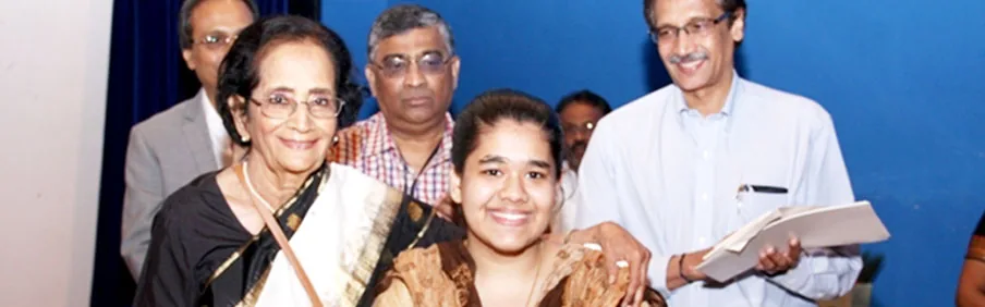 Alumni family at a TNMC award ceremony