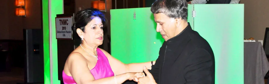 Alumni dancing at a TNMC reunion gala evening