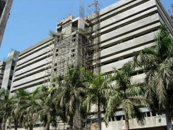 BYL Nair Hospital tower among palm trees