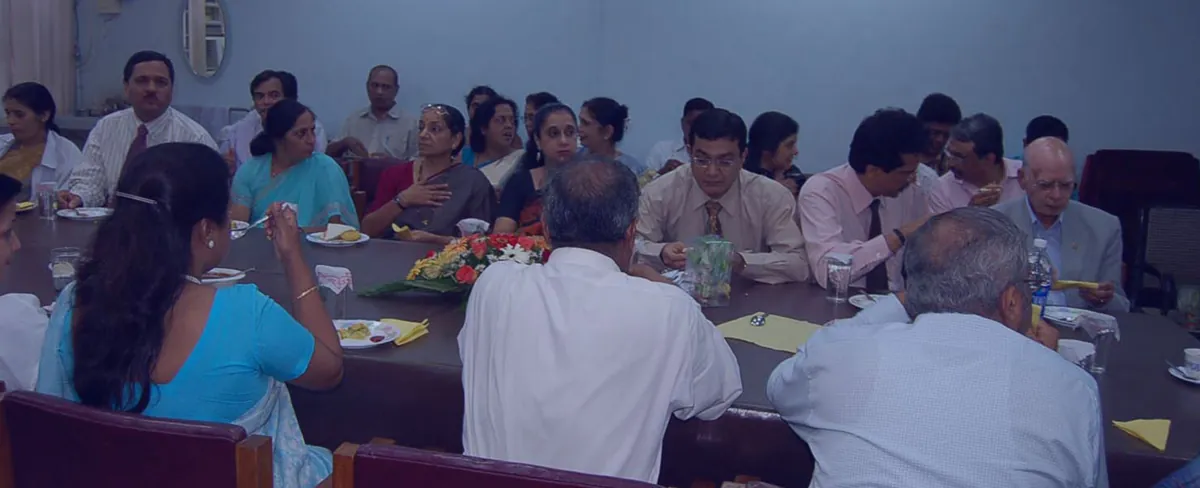 Alumni and teachers at a TGA meeting